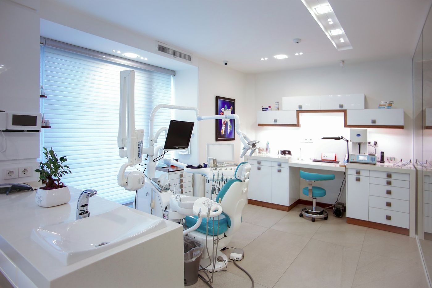 Bright dental treatment room with chair