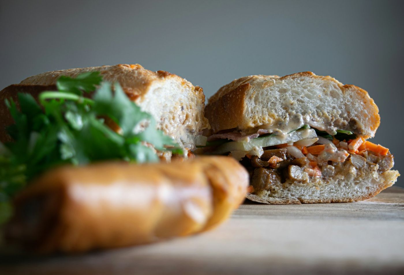 A bánh mì packed with grilled pork and herbs