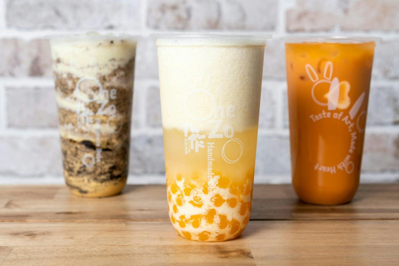 Three bubble teas on a wooden table