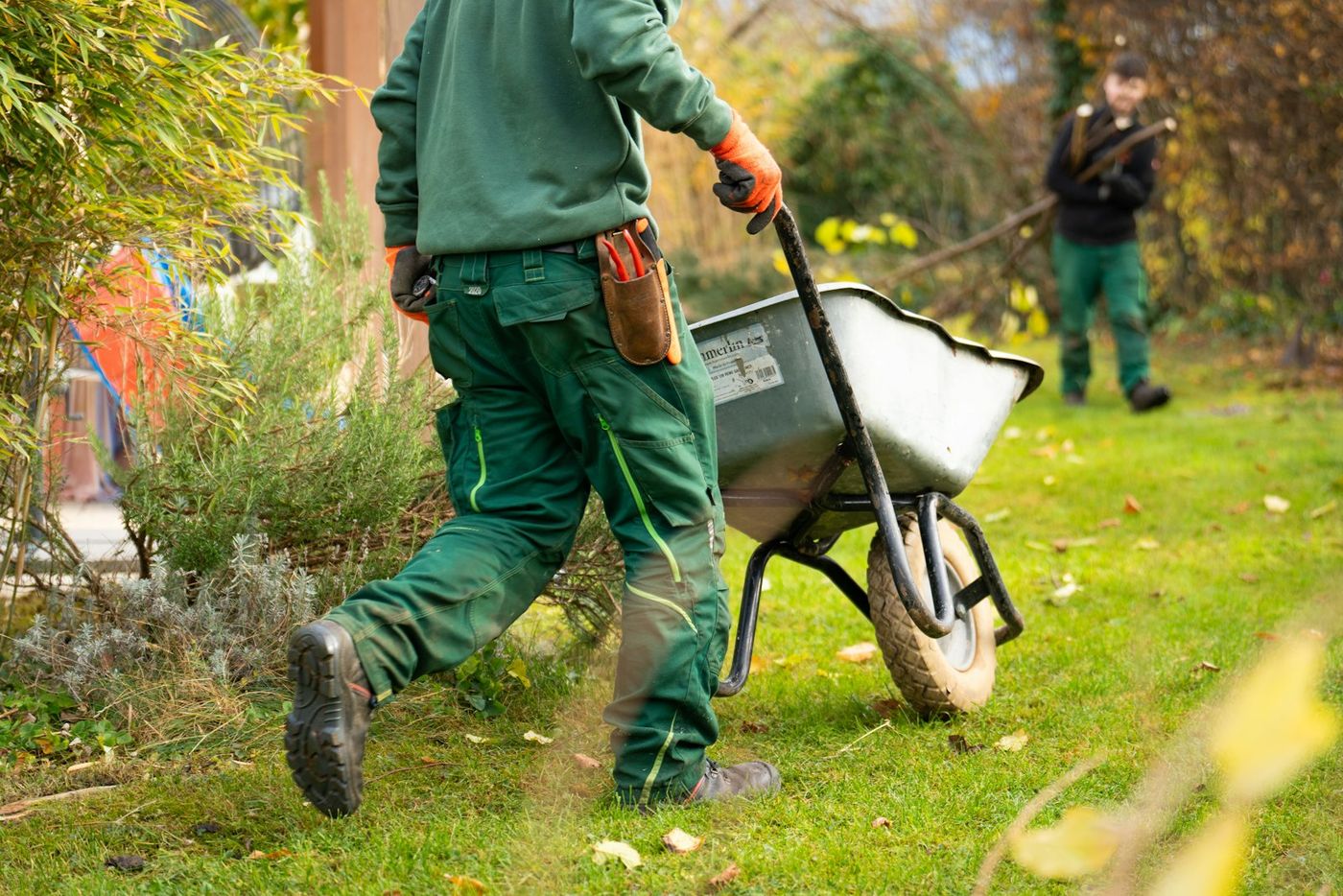 Landscaper pushing a wheelbarrow