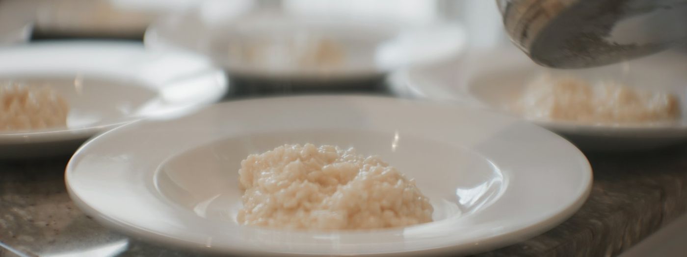 Pumpkin risotto being plated